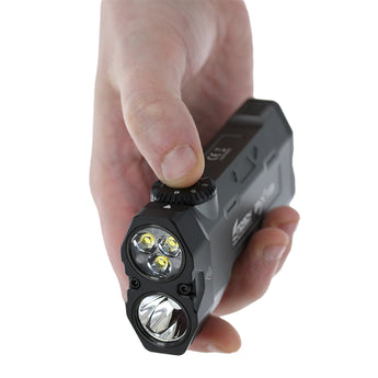 Fitorch PX18 LED flashlight black version held in a hand with LEDs visible