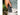 Hand holding a gray leatherman sleeve case with a blurred natural background