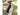 Person holding a knife with a black sleeve against a blurred natural background