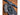 Watch, knife, and carabiner on a textured surface