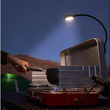 Nite Ize attached to and shining down on a grill