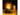 Nite Ize lantern emitting a warm glow on a table with a mug in the background.