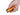Orange Olight Baton Turbo Rechargeable LED Flashlight - Held in Hands