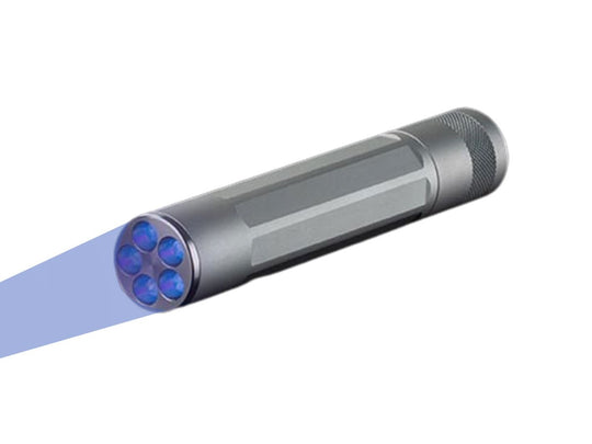 nite ize inova x5 uv flashlight angled down and to the left