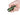 Green Olight Baton Turbo Rechargeable LED Flashlight - Held in Hands