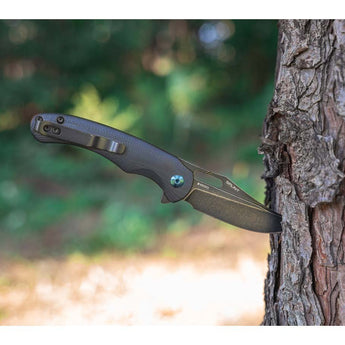 Olight Splint Folding Knife - Black - In Action - Tree