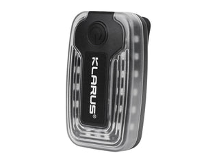 Klarus light with clear casing on a white background