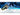 Nitecore HA29 UHE MCT all-weather outdoor headlamp in a snowy mountain setting.