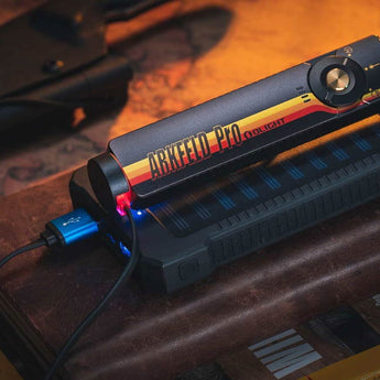 Olight Arkfeld Pro Rechargeable LED Flashlight - 1300 Lumens - Cool White or Neutral White LED - 365nm UV - 520nm Green Laser - Uses Built-in 1500mAh Li-Poly Battery Pack - Black and Additional Colors